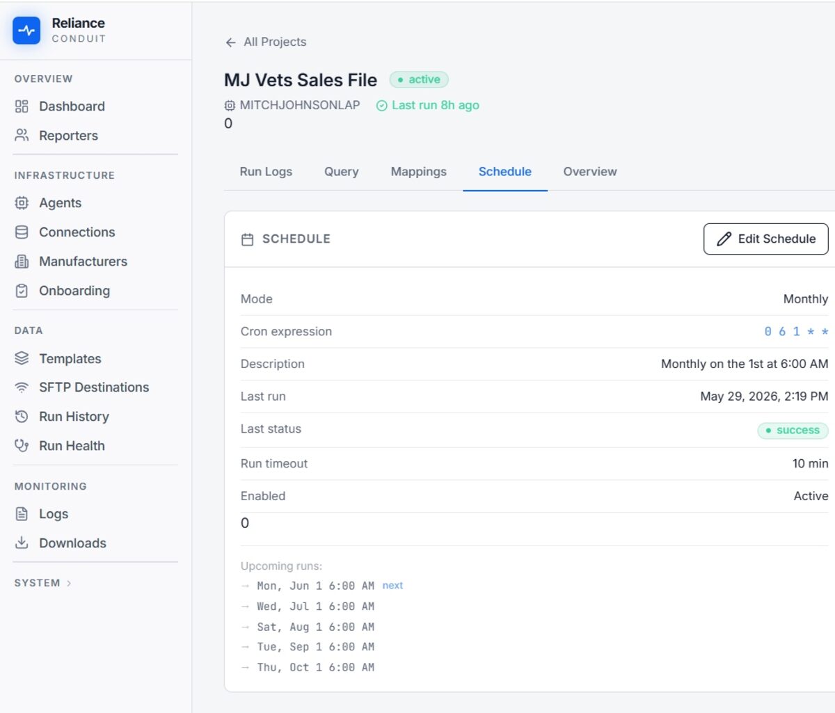 Reliance Conduit schedule view — a report set to run monthly on a cron schedule, showing last run status, run timeout, and upcoming run dates.